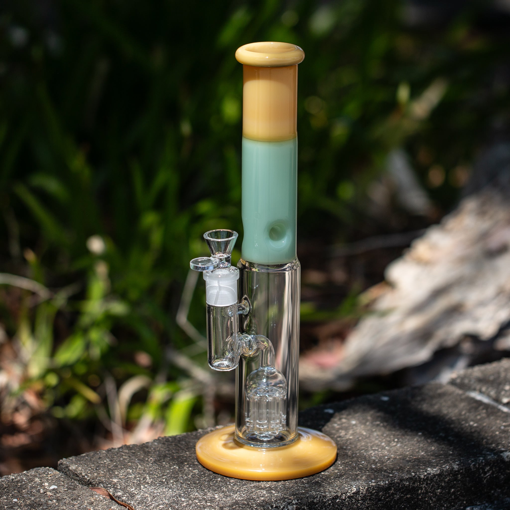 Pretty glass bong with percolator sitting on ledge at Australian smoke shop.