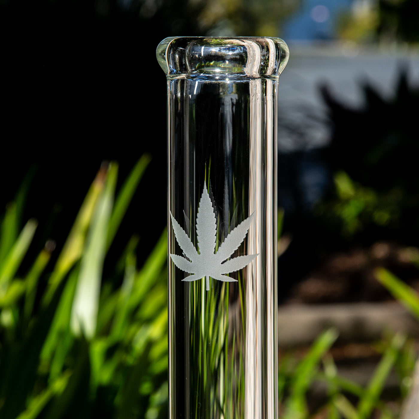 Cannabis weed leaf etched into glass beaker bong Australia.