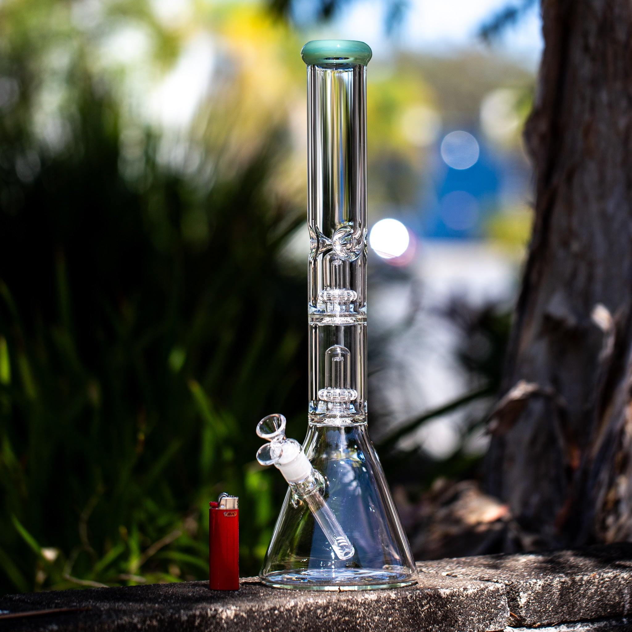 Large glass beaker bong in the Australian sun.