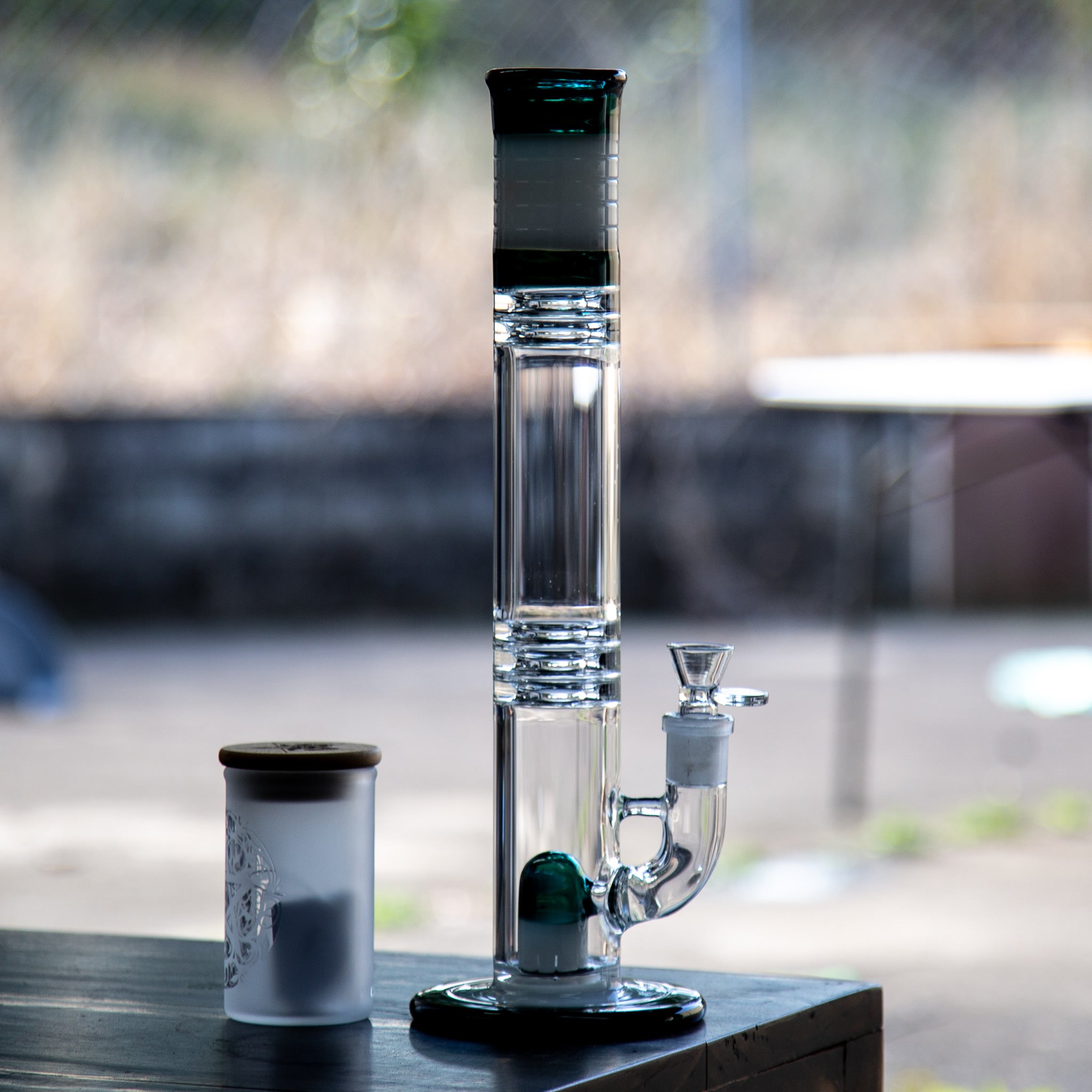 Straight glass bong with coloured glass and stemless design.