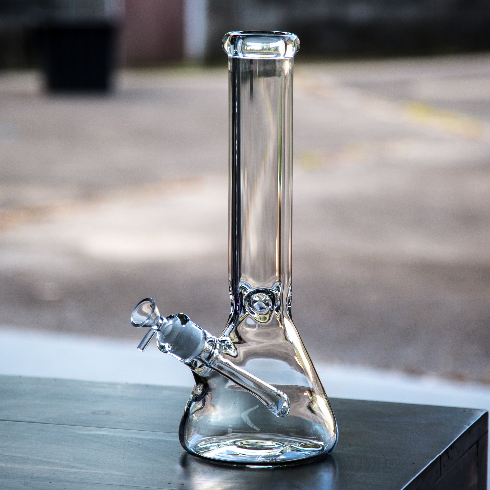 Thick and heavy clear glass beaker bong.