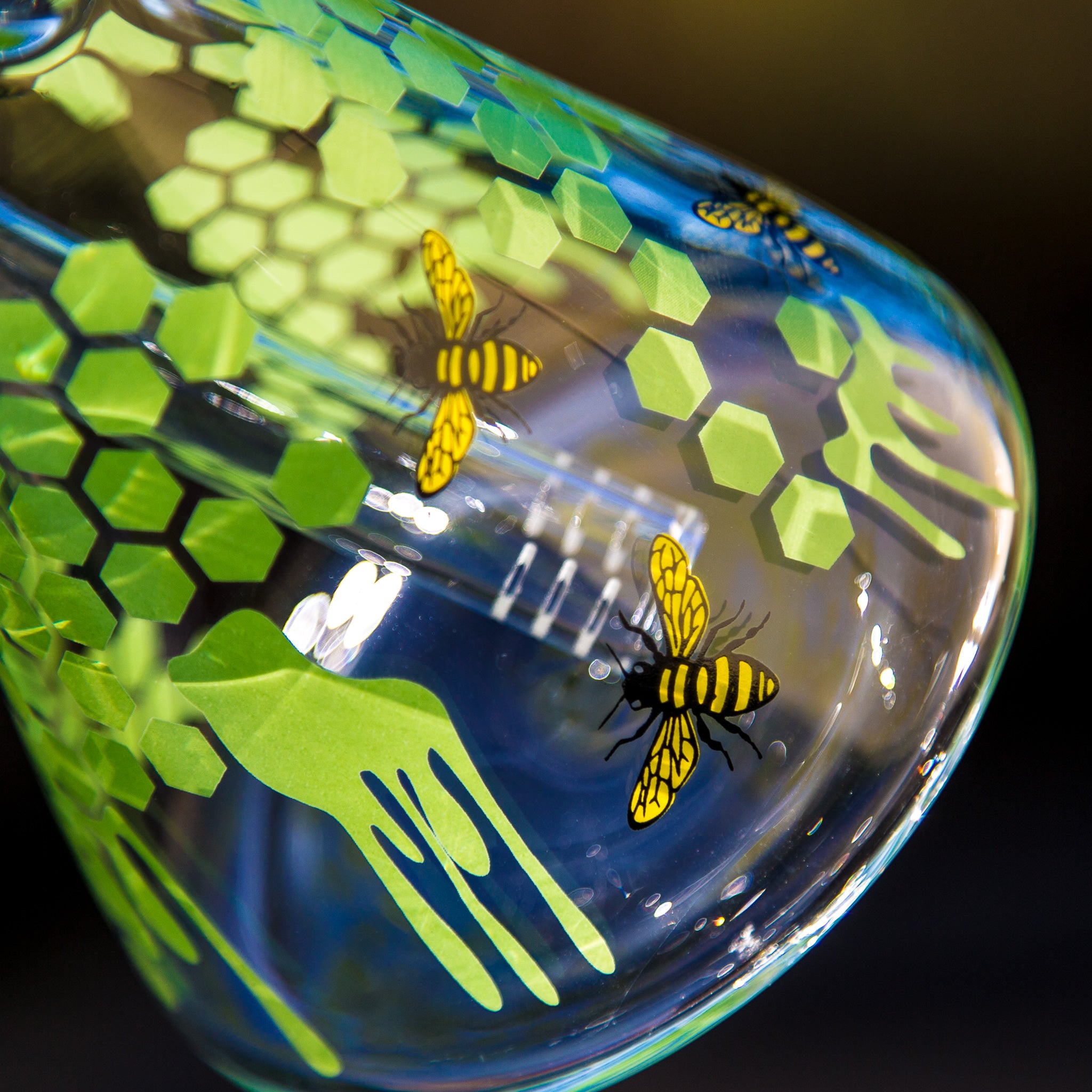 Closeup of decals on a honeybee glass beaker bong from Easy Bong Australia.