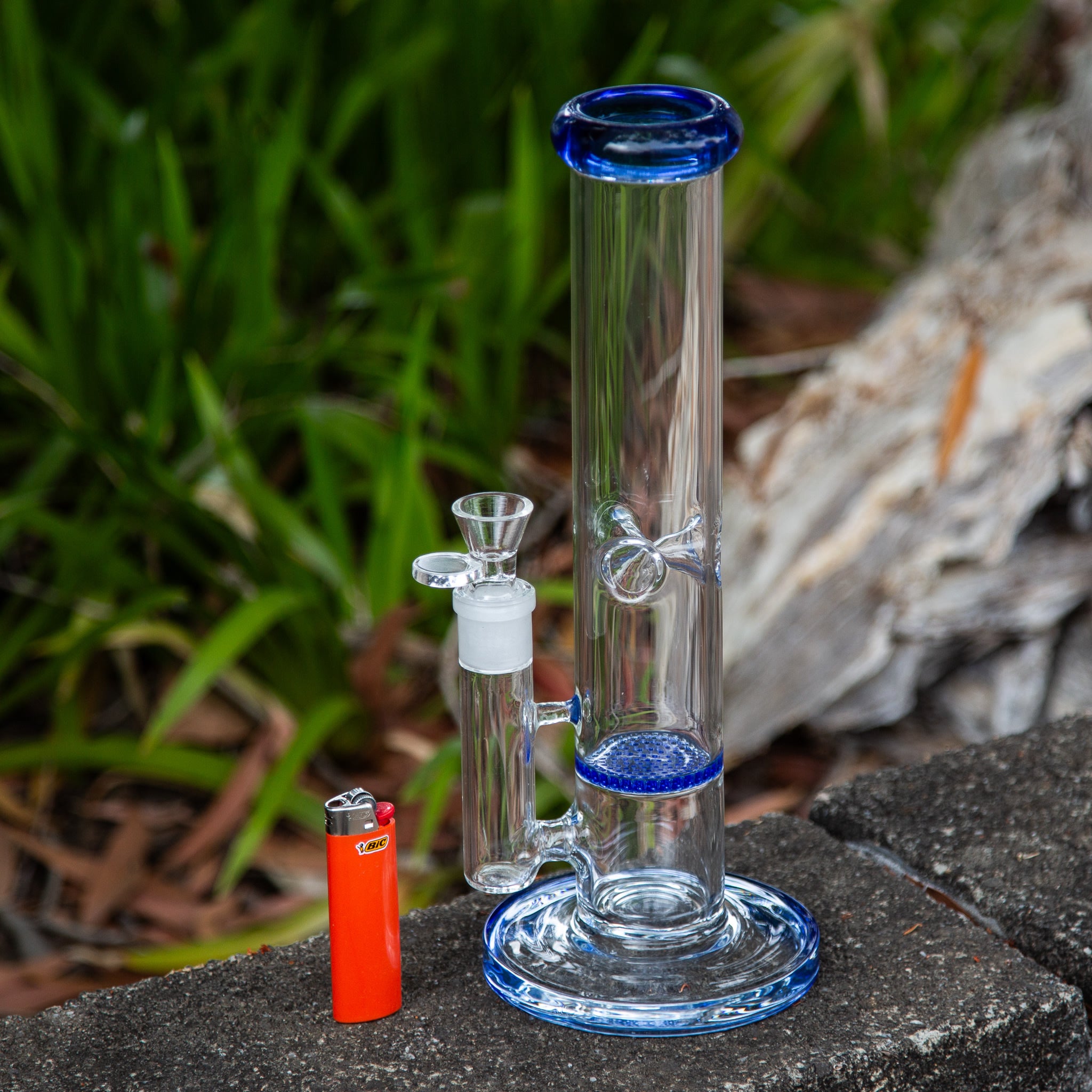 Clear glass bong with colourful features and 18mm cone piece.