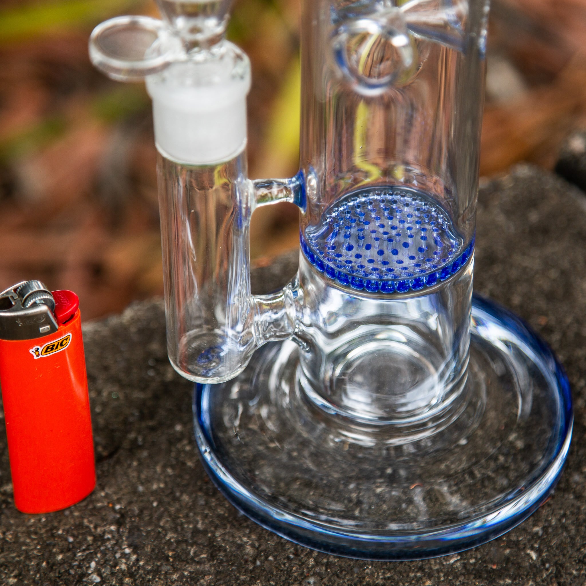 Close up view of honeycomb disc in glass bong.