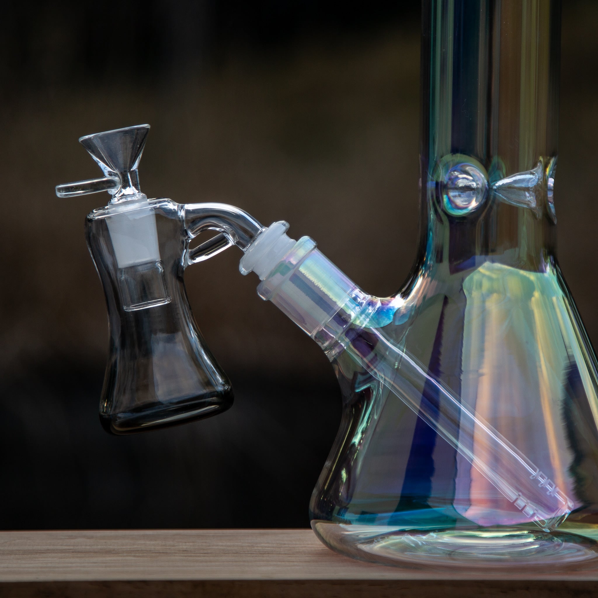 A glass beaker bong with ash catcher and cone piece in Australia.